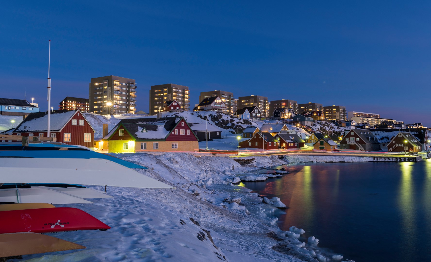 View over the old town and the colonial harbour towards the modern quarters of Nuuk, capital of Greenland.